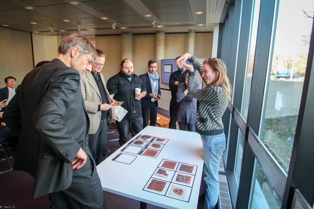 Photo of people discussing during the final review