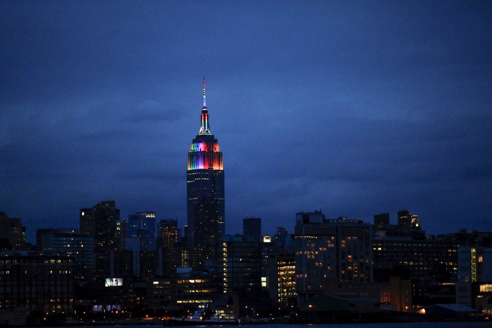 The Empire State Building is lit in rainbow colors during the celebration of the annual Gay Pride Parade in New York June 28, 2015. REUTERS/Eduardo Munoz - RTX1I6OS