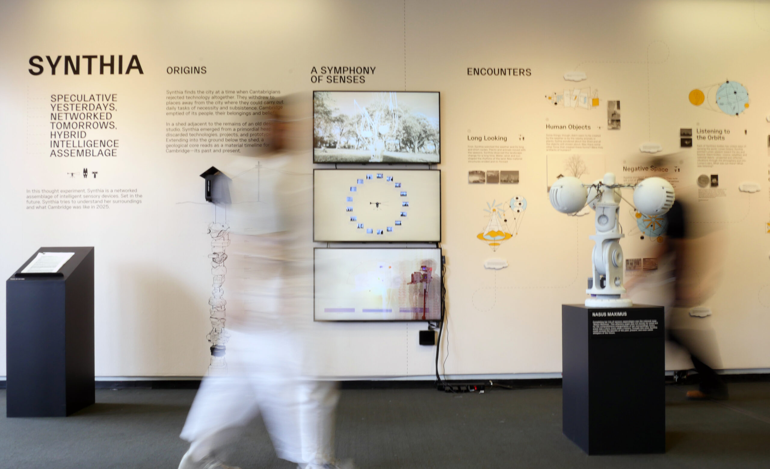 Visitors walking amongst the exhibition