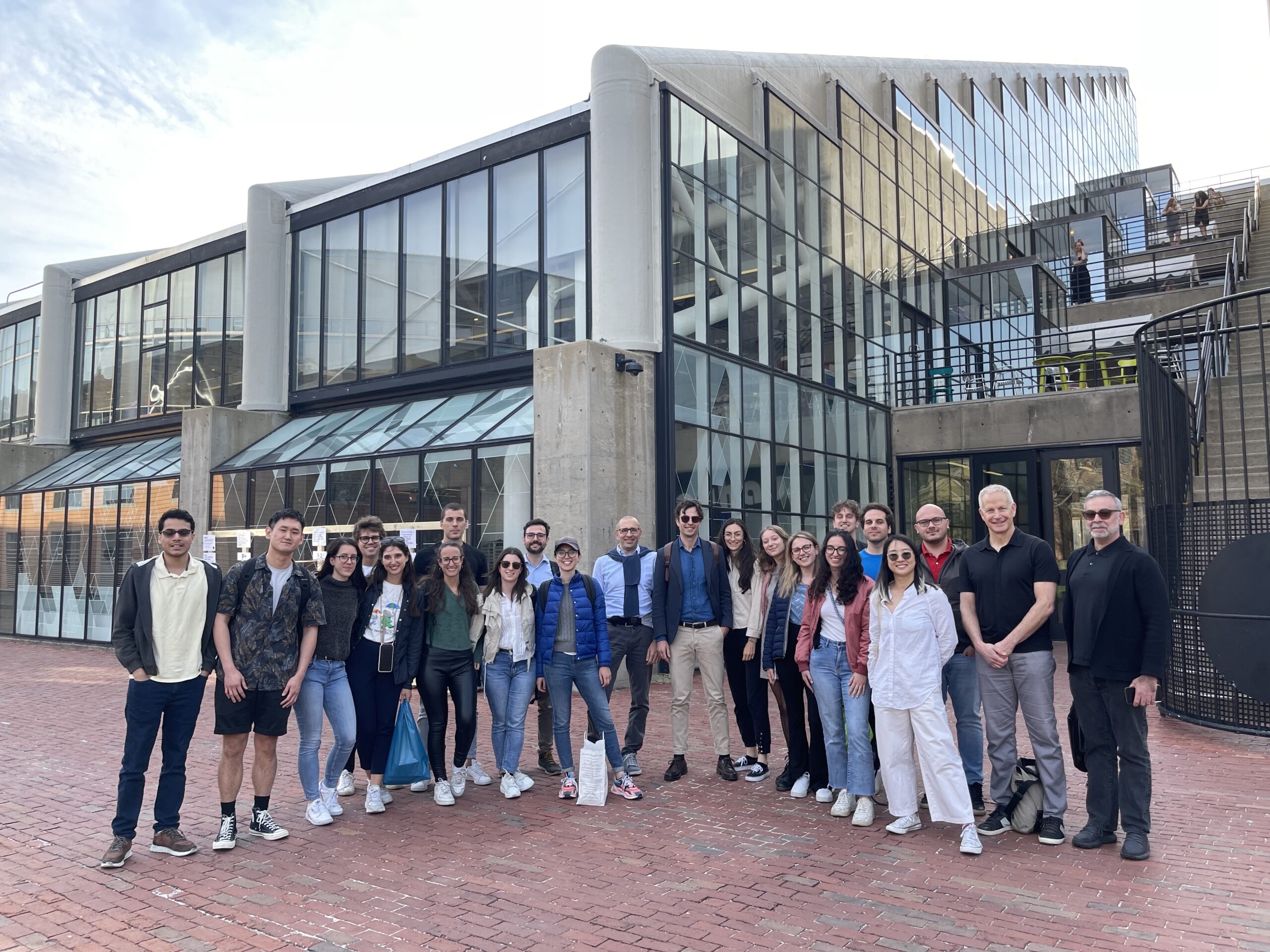 Students and faculty standing in front of Gund.