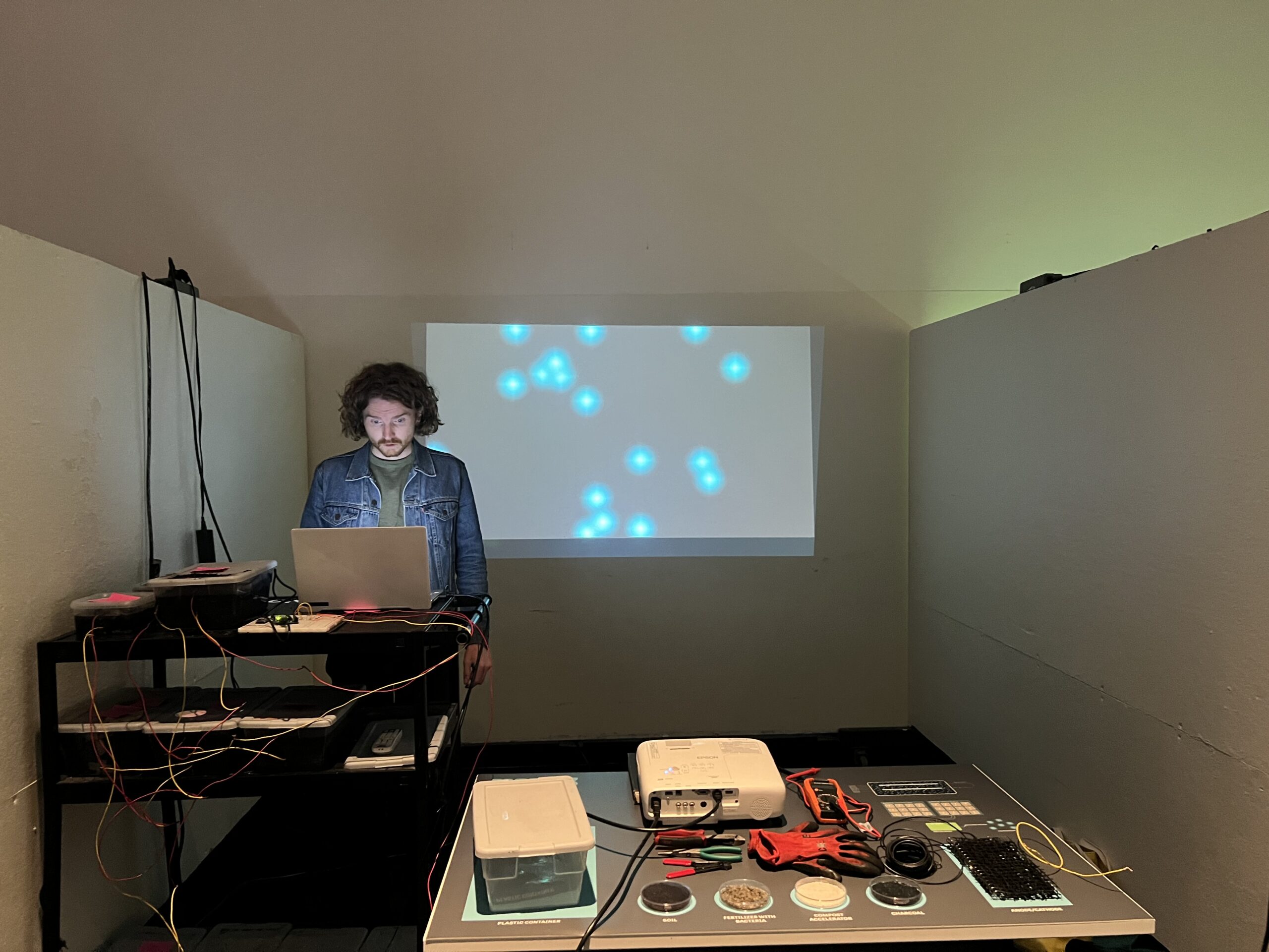 Student standing infront of a projection